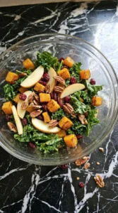 Fall Harvest Salad kale mixed with roasted squash apples and pecans Recipe focus: fall kale salad.