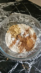 Gluten Free Gingerbread Cookies dry spice mixture being combined in a bowl Recipe focus: gluten free egg free gingerbread cookies.