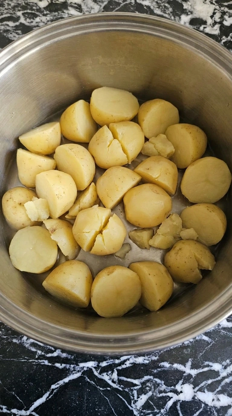 Make Ahead Mashed Potatoes with tender yellow potato chunks in a large cooking pot Recipe focus: make ahead mashed potatoes recipe.