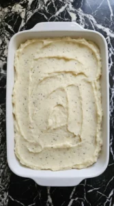 Make Ahead Mashed Potatoes mixed with dairy and spread in a baking dish before chilling Recipe focus: easy make ahead mashed potatoes.