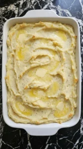 Make Ahead Mashed Potatoes reheated with melted butter and lightly golden edges Recipe focus: easy make ahead mashed potatoes.