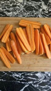 Maple Glazed Carrots preparation showing raw Nantes carrots halved lengthwise Recipe focus: easy maple glazed carrots.