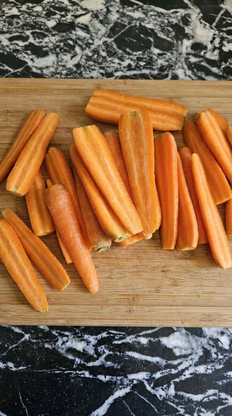 Maple Glazed Carrots preparation showing raw Nantes carrots halved lengthwise Recipe focus: easy maple glazed carrots.