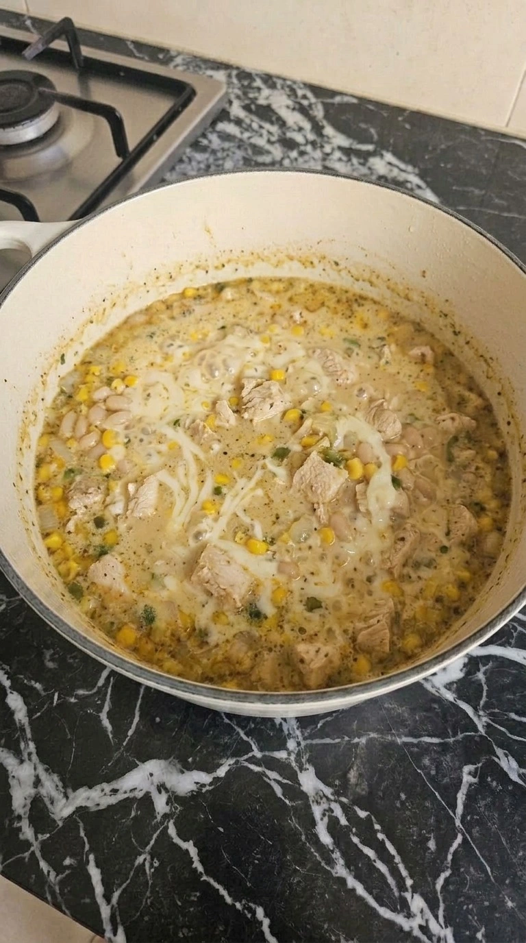 Mexican Street Corn White Chicken Chili creamy cheese finish folding into the chili Recipe focus: crockpot white chicken chili.