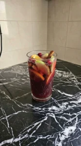 Non Alcoholic Christmas Punch served glass with fruit garnish Recipe focus: easy christmas punch non alcoholic.