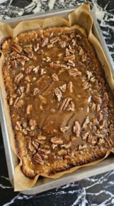 Pecan Pie Bars baking with toasted pecan topping and amber filling over golden shortbread. Recipe focus: easy pecan pie bars.