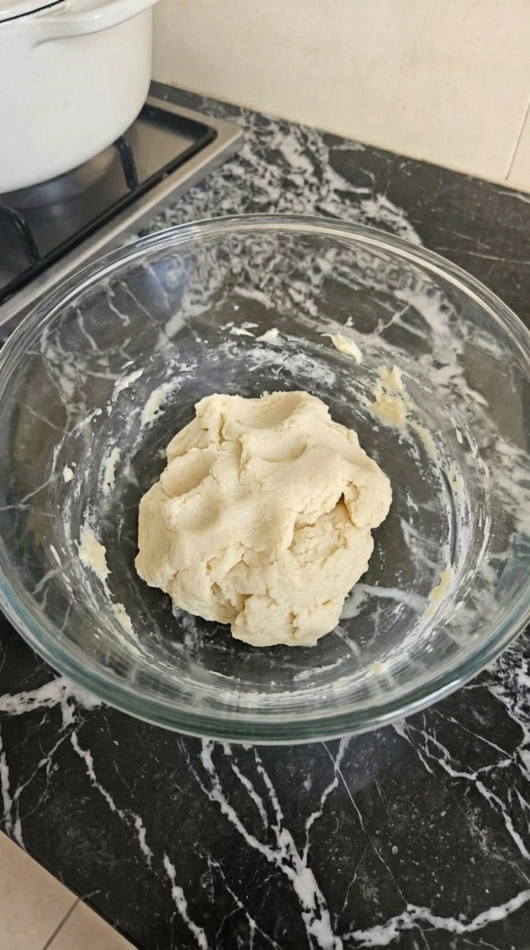 Soft pale sugar cookie dough mixed with flour and baking powder for Pink and Orange Halloween Cookies.