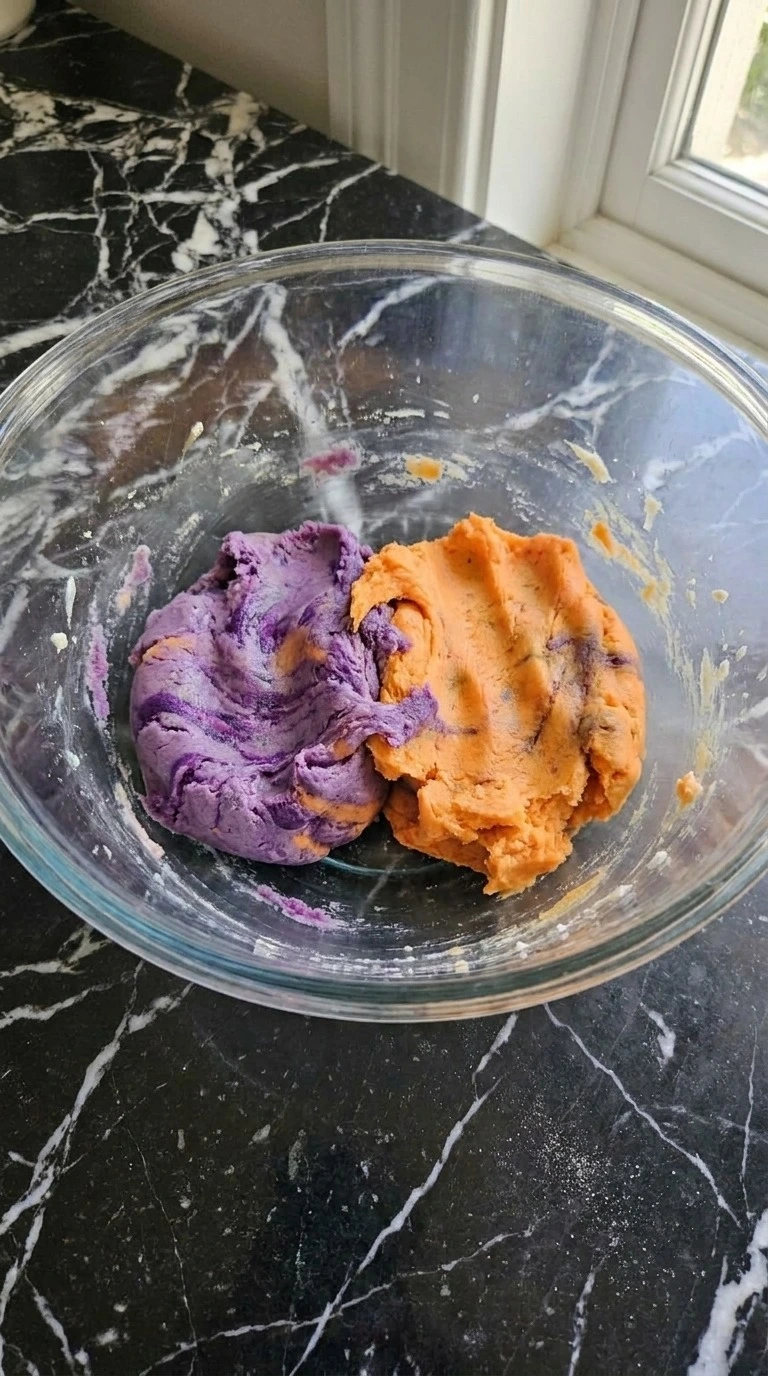 Purple and Orange Halloween Cookies dough divided into vivid purple and orange portions