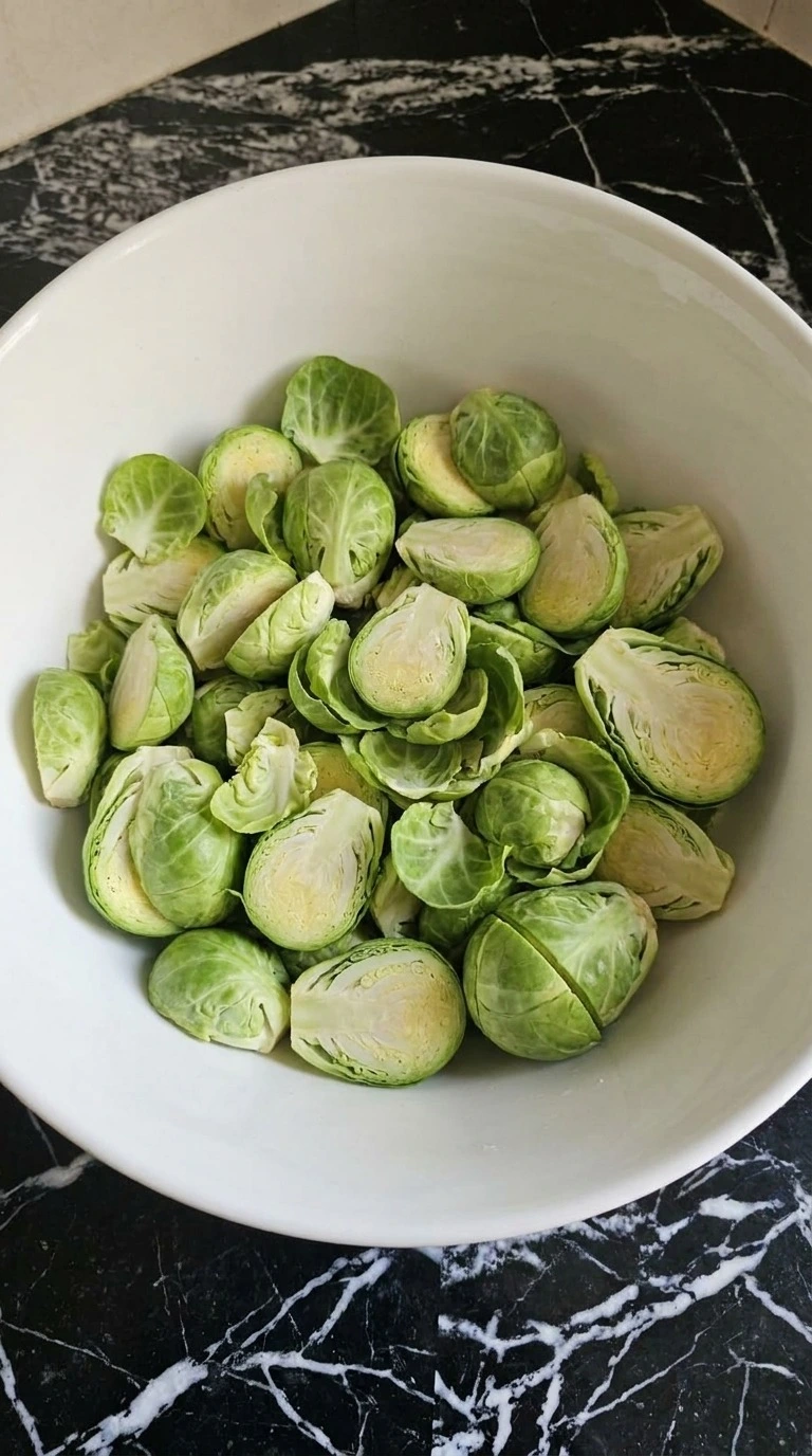 Roasted Brussels Sprouts with Bacon preparation showing fresh green sprouts trimmed and halved Recipe focus: easy roasted brussels sprouts with bacon.