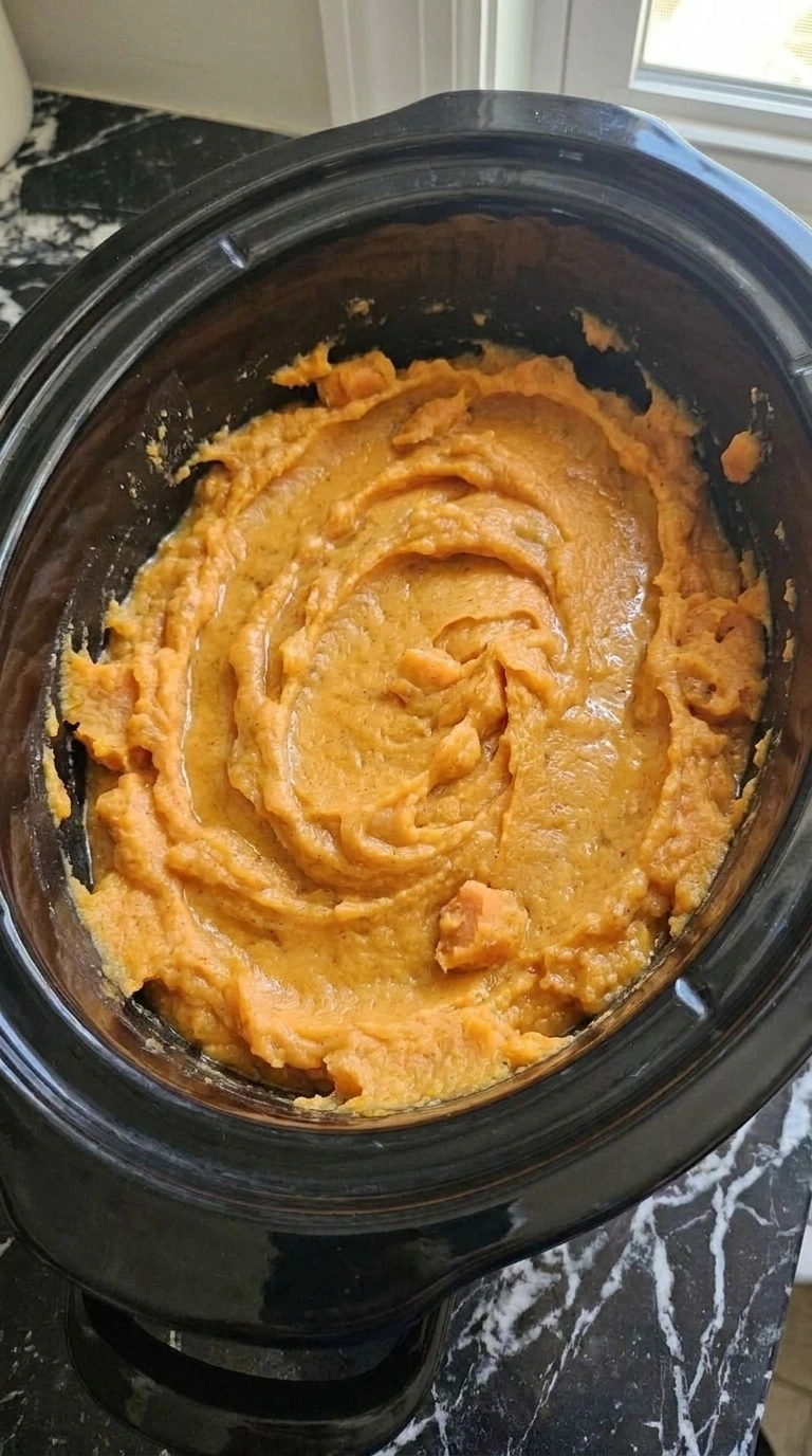 Creamy orange Slow Cooker Mashed Sweet Potatoes mixed with melted butter, whole milk, maple syrup and Recipe focus: easy slow cooker mashed sweet potatoes.