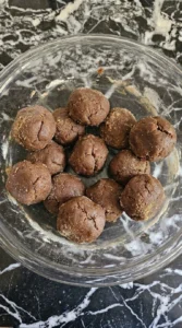Soft Gingerbread Cookies dough balls shaped before baking Recipe focus: soft and chewy gingerbread cookies.