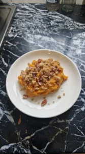 Sweet Potato Casserole with Pecans single serving showing creamy layers Recipe focus: ruths chris sweet potato casserole.