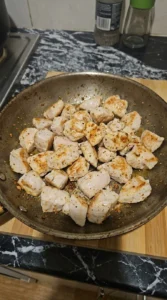 White Bean Chicken Chili chicken pieces browning with seasoned surfaces Recipe focus: creamy white chicken chili.