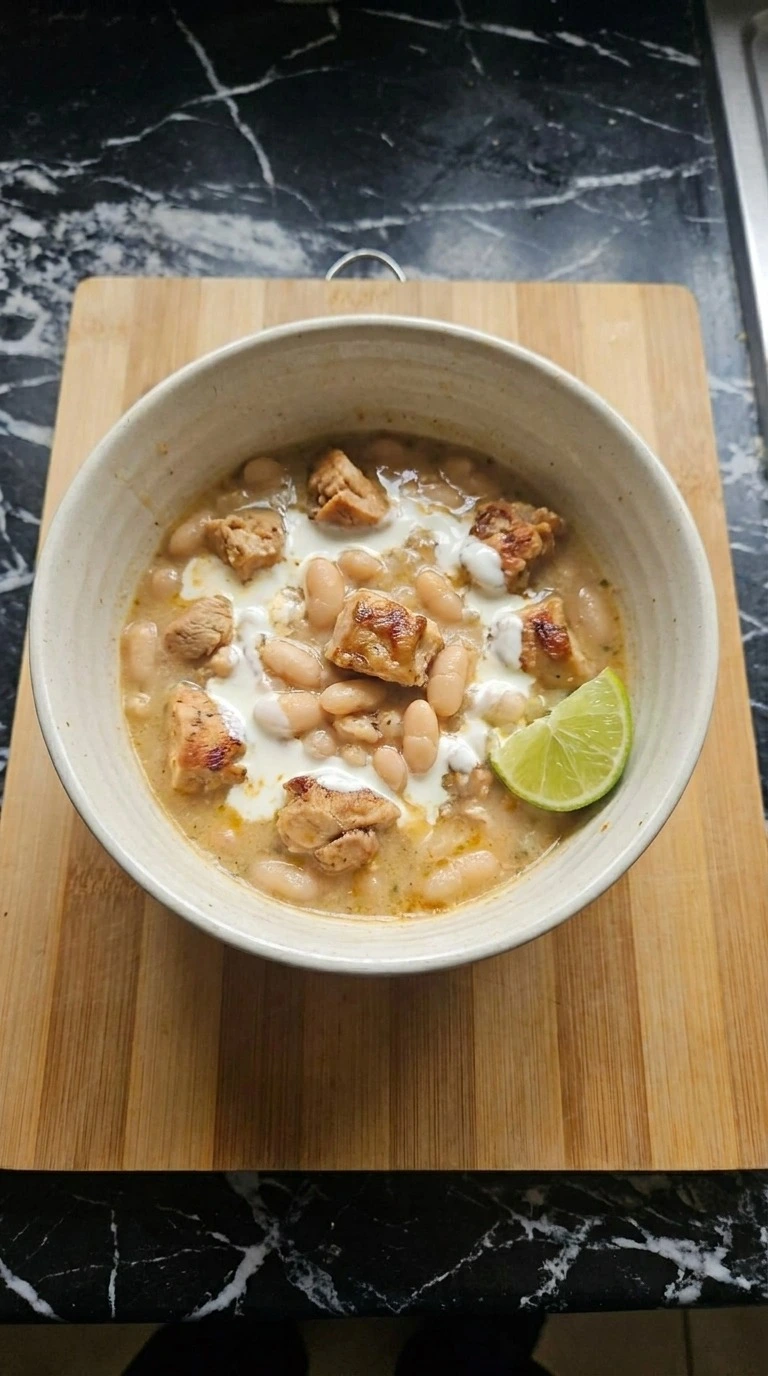White Bean Chicken Chili finished serving with creamy broth and chicken pieces Recipe focus: easy white chicken chili.